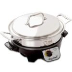 Black slowcooker with shallow pan on it.