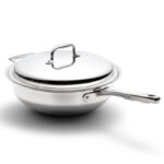 Topview of steel wok with lid, one long handle and one short handle.