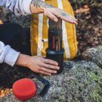 Aeropress Go being used by hiker.