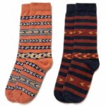 Pairs of quarter-length socks with festive patterns of orange, blue, red and white.