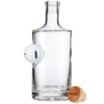 Glass decanter with embedded golfball.