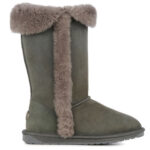 Grey, high sheepskin boot with rubber sole, a reinforced heel cup and grey fur trimming down the side and around the opening.