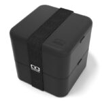 Black, plastic cube-shaped lunchbox with black, broad elastic band.