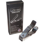 Stainless steel toenail clipper next to its packaging which says "made in the USA".