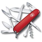 Classic Victorinox swiss army knife with blades, scissors, can- and bottle opener, saw, corkscrew, awl, hook, tweezers and toothpick.