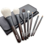 Selection of Hakuhodo make-up brushes with elegant dark wooden handles