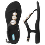 Black, sandal style, flip flops with large half pearl buttons on front strap