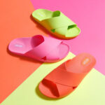 Green, pink and red flip flops with overarching, overlaping bands