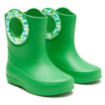 Green children's rain boots with sticker around the carrying holes showing dinosaurs