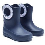 Dark blue children's rain boots with sticker around the carrying holes showing boats and lifebuoys