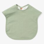 Green bib with red snap closure