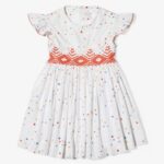 White dress decorated with colored dots, embroidery along the waist and flutter sleeves.