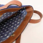 Blue lining on inside of bag with white moose patterns