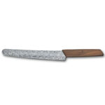 Breadknife with wooden handle and steel blade decorated with swirling motives