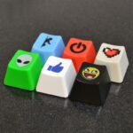 Keycaps in a range of colors and with uncoventional designs printed on them