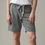 Grey short reaching just above the knee and held closed with white drawstring