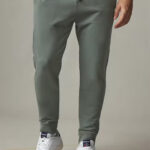 Frontview of green sweatpants with drawstring.