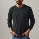 Man wearing black, longsleeve t-shirt with front pocket.