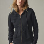 Woman wearing black hoodie with zipper and pockets.