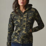 Woman wearing camouflage patterned hoodie with zipper and pockets.