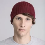 Young man wearing red beanie hat.