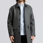 Man wearing grey wool overcoat.