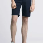 Dark navy, knee-length shorts.