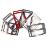 Selection of slotted belt buckles in grey, red and copper.