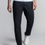 Man wearing dark navy cotton chino trousers.