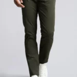 Man wearing khaki green cotton chino trousers.