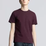 Young man wearing burgundy cotton t-shirt.