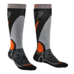 Overcalf ski socks in various shades of grey and black with orange detailing.