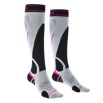 Black and light grey overcalf ski socks with purple detailing.