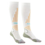 White overcalf ski socks with grey and yellow detailing.