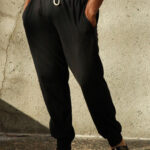 Man wearing black cotton jogger pants.