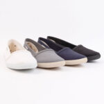 Simple white, grey, navy and black men's slipon shoes.