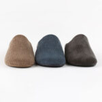 Men's slipon slippers in beige, brown and blue.