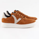 Light brown men's sneakers with white detailing.