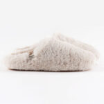 Fuzzy, white women's slip on slippers.