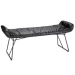 Backless bench with black leather upholstery.