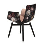 Chair with flower-patterned fabric upholstery and sturdy legs.