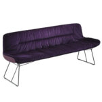 Bench with purple leather upholstery.